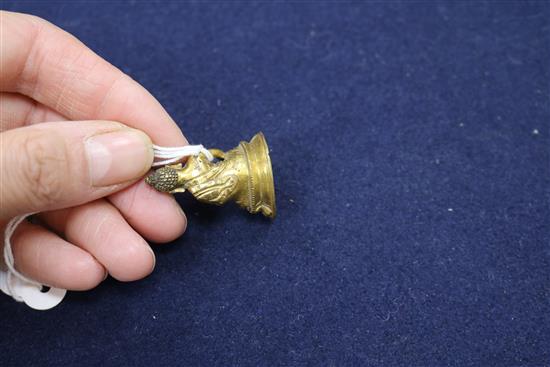 A Tibetan miniature gilt bronze seated figure of Buddha Shakyamuni